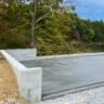A concrete foundation installation for a garage or shed