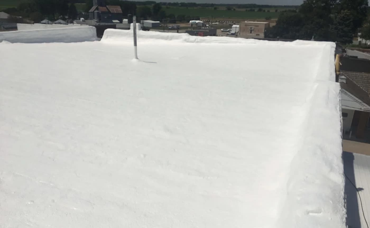 Completed spray foam roofing project by A&M Contractors Inc.