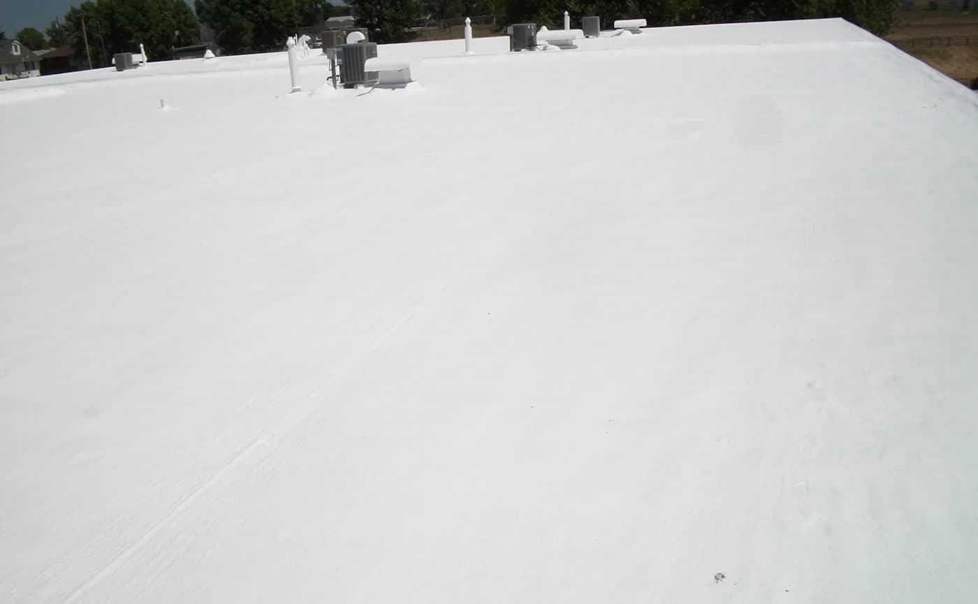 Completed spray foam roofing project by A&M Contractors Inc.