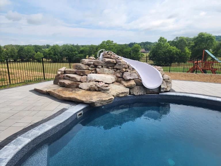masonry waterslide with new pool deck - The Concrete Gentlemen