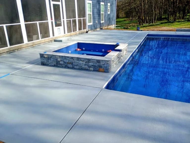 custom concrete pool deck with hot tub - The Concrete Gentlemen