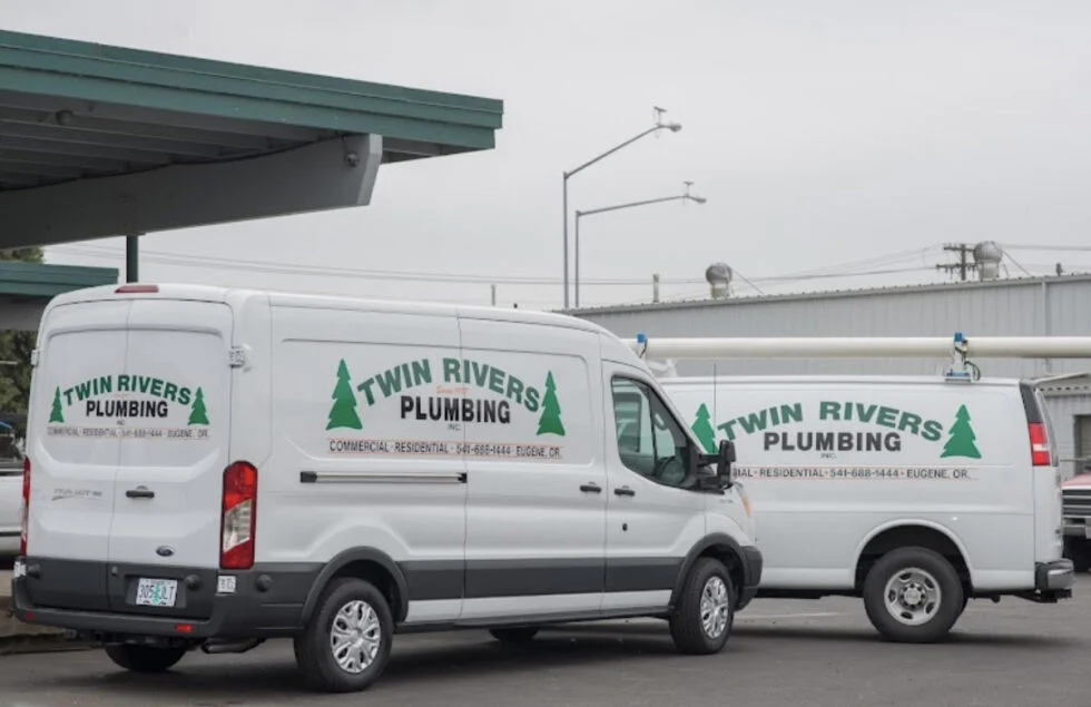image of two Twin Rivers trucks, driven by master plumbers
