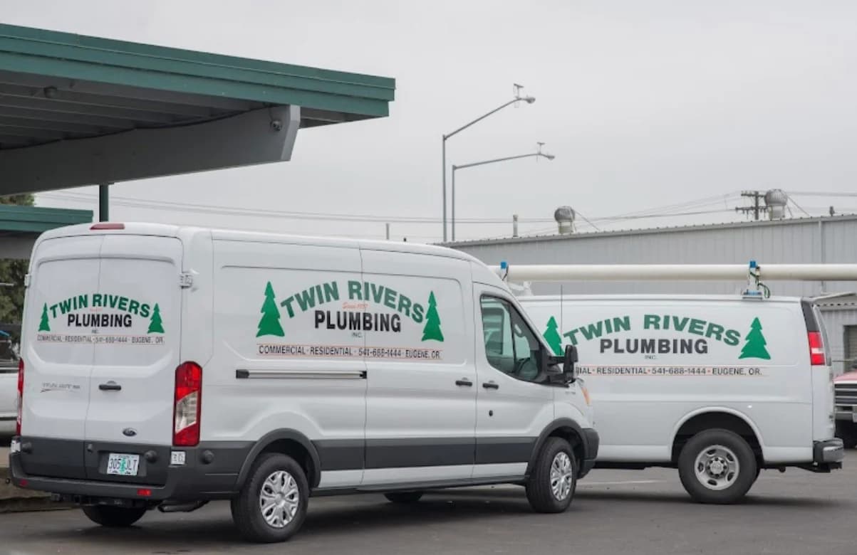 image of two Twin Rivers trucks, driven by master plumbers