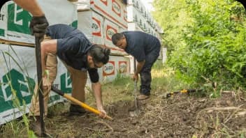 workers detecting leak and repairing it
