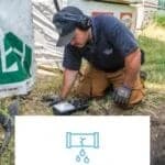 man on grass outside using a device to diagnose plumbing problem