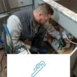 man fixing problem plumbing