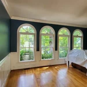 Dark blue living room painting in the North Ridge neighborhood in Raleigh, after removing the wallpaper.