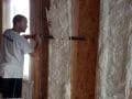 worker applying spray foam