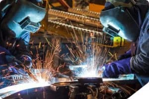 Welders working with sparks flying.