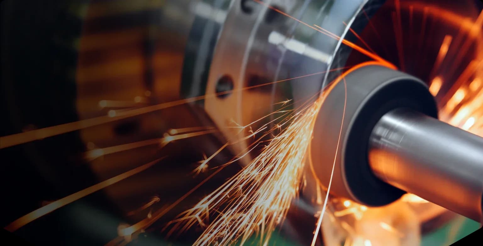 Metal grinding sparks, industrial process.