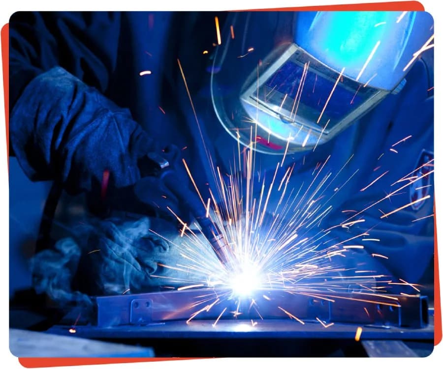 Welder sparks metal fabrication work.
