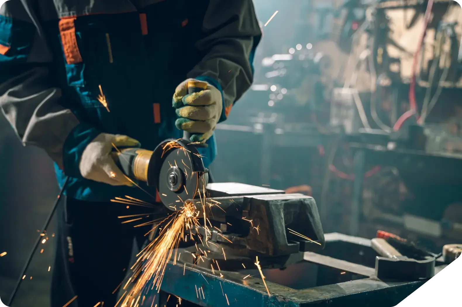 Person using angle grinder with sparks flying.