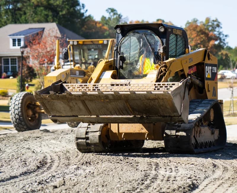 Team member in skidsteer