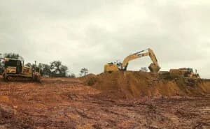 Tractors performing construction site development