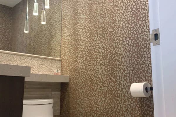 Precision Painting Plus commercial interior bathroom wallpaper installation