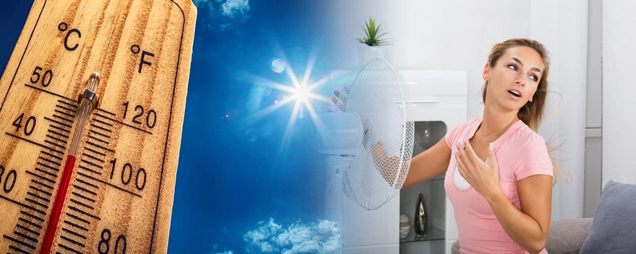 An overheated woman turns on a fan