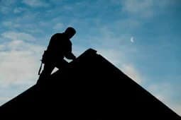 professional roofers from Logan Roofing installing a new roof in Logan Utah