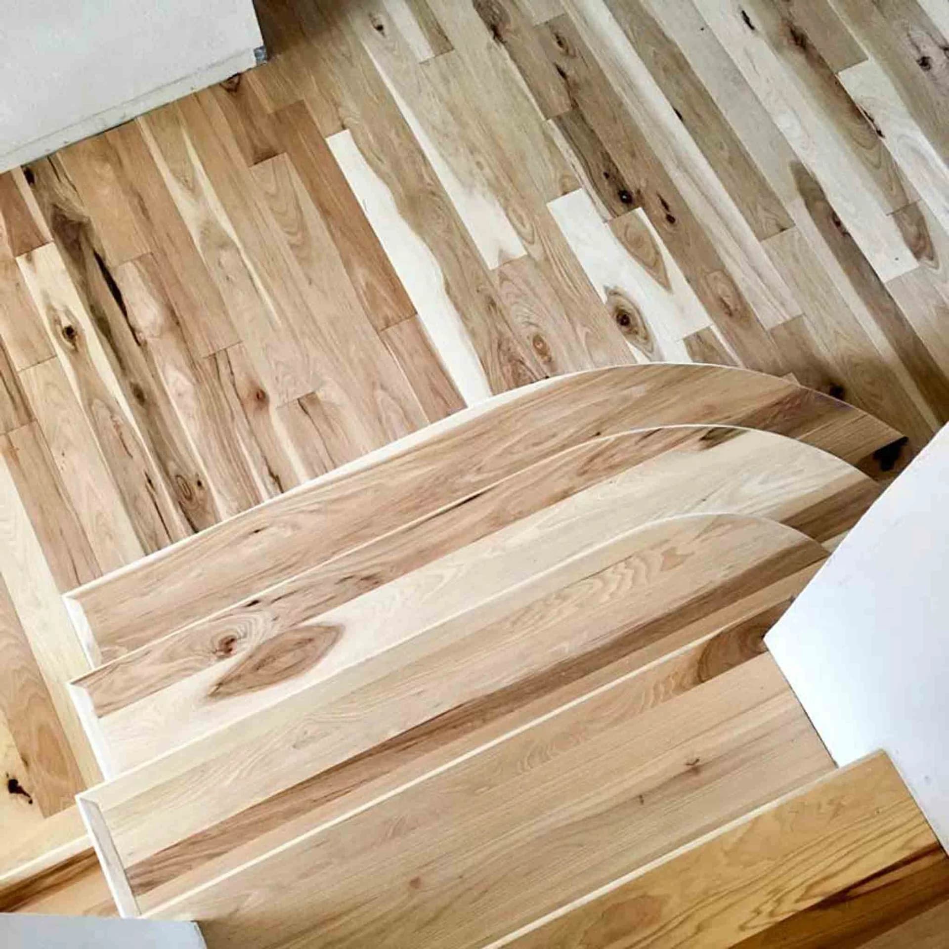 Wood flooring with dark and light patterns, done by Footprints Floors.