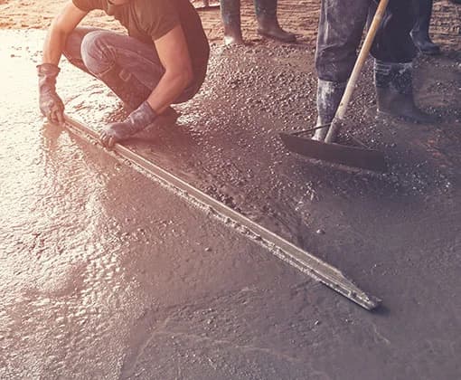 Concrete finisher screeding concrete