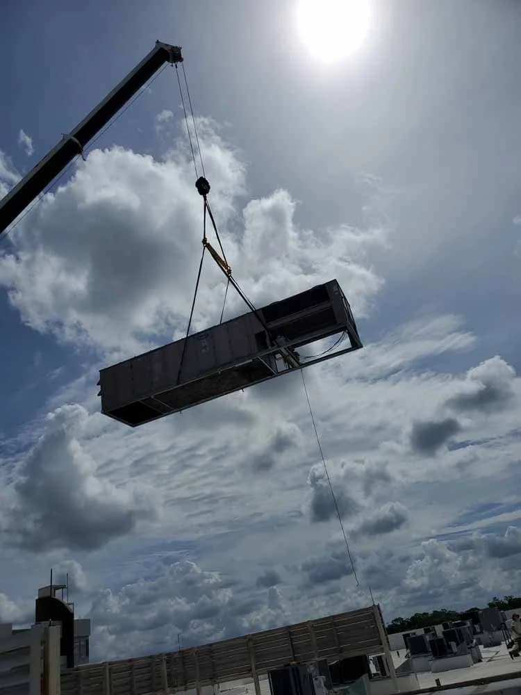 Old Packaged Unit Being Flown Off The Roof by CMS