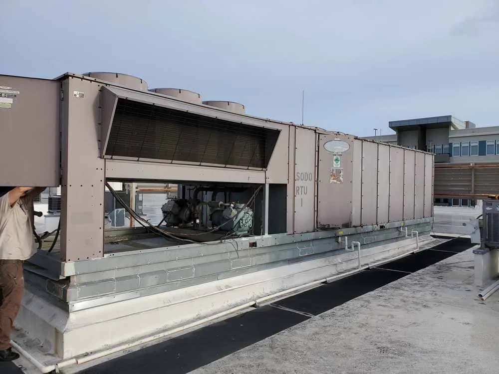 Old Packaged Unit Being Disconnected for Removal by CMS