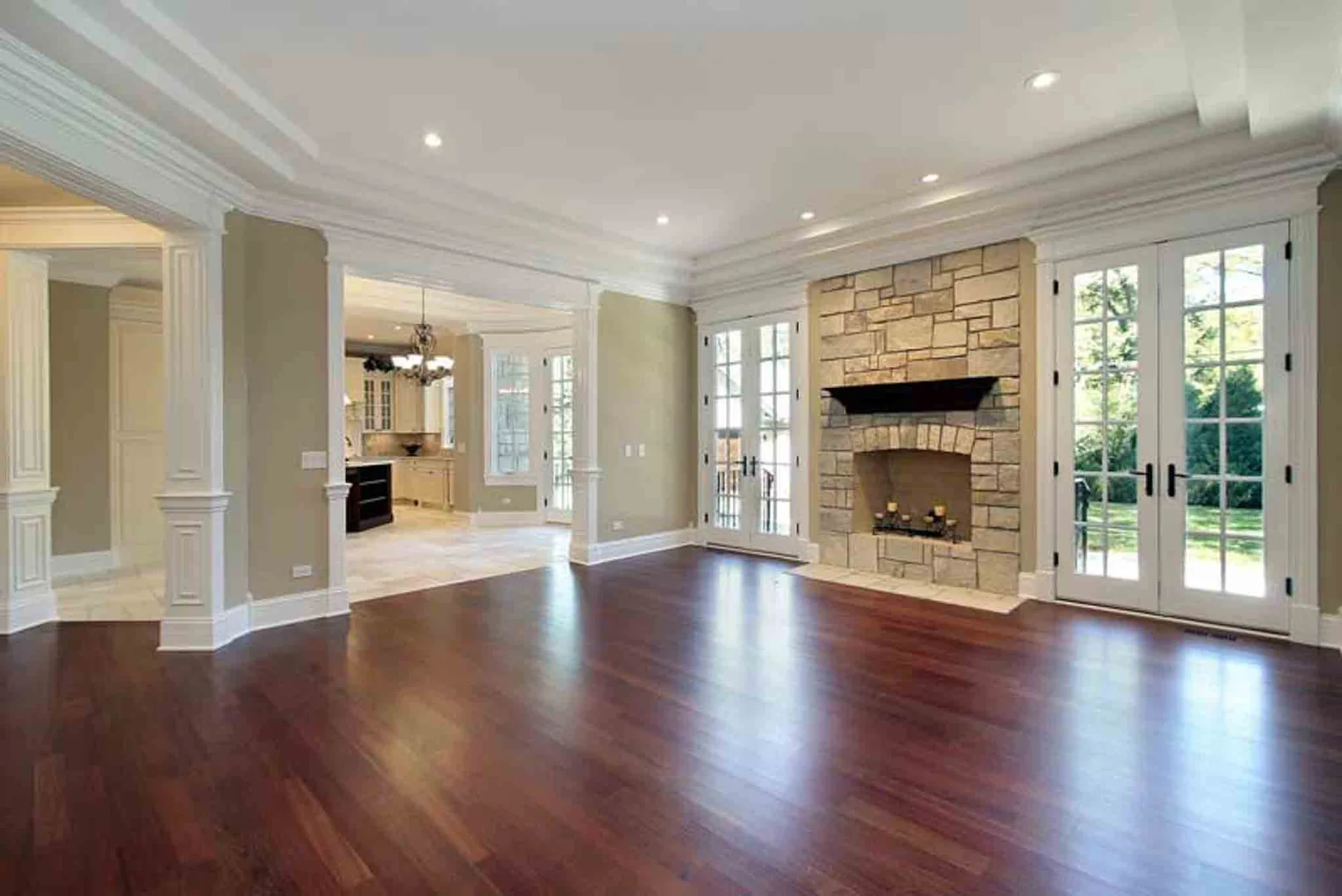 Footprints Floors dark wood floor installed in a home with a fireplace.