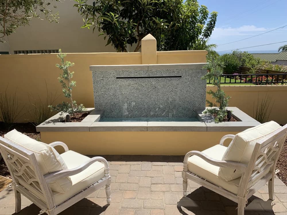 Stone fountain in outdoor dining area