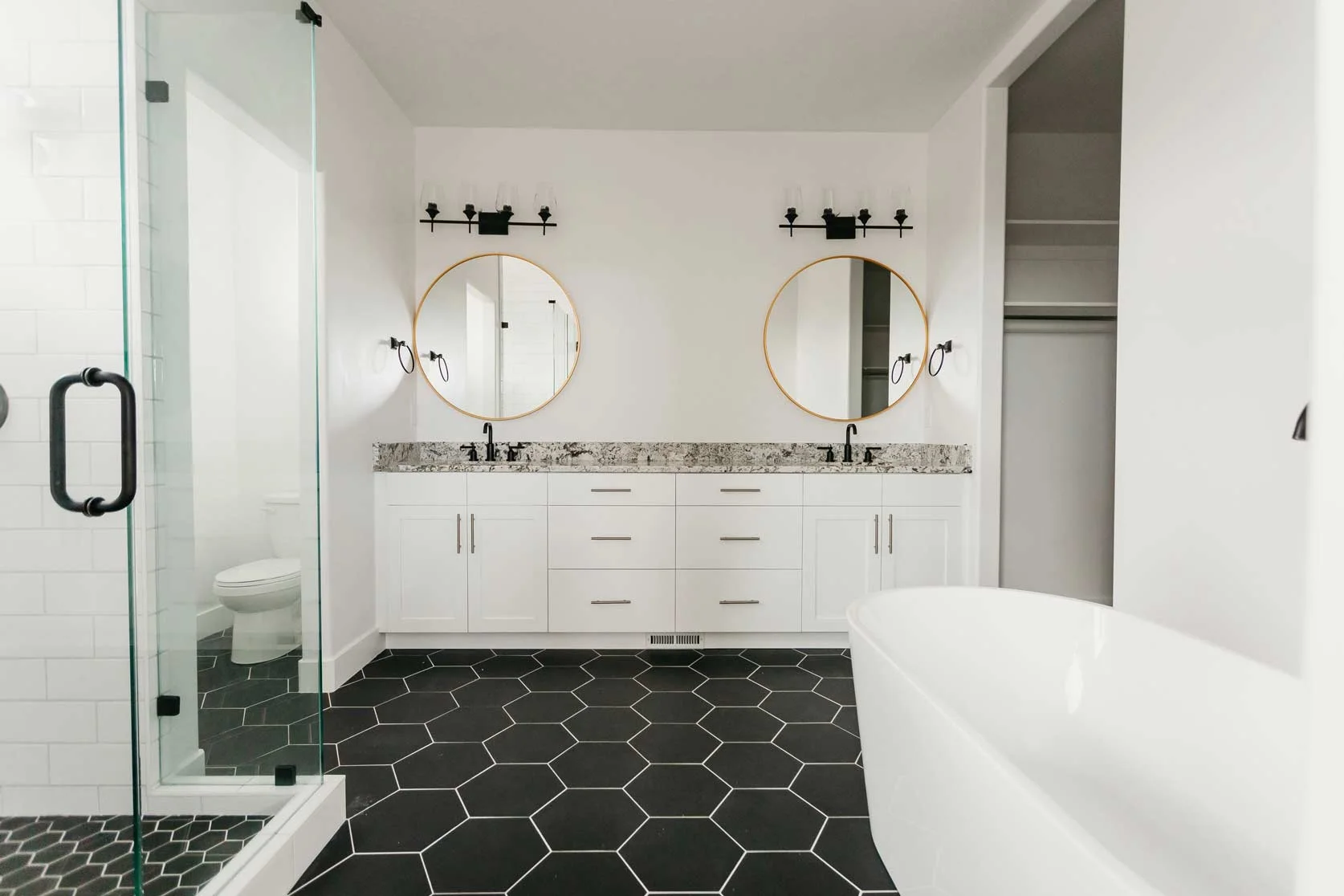 double bathroom vanity with black & white tile by 10x builders in utah county