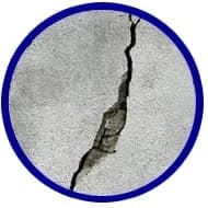 Cracked concrete slab illustrating foundation issues, relevant to American Foundation Specialists' structural repair services.