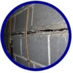 Cracked foundation wall showing visible separation and structural damage, relevant to American Foundation Specialists' services for foundation repair and basement waterproofing.