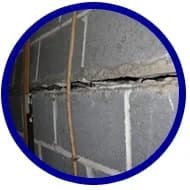 Cracked foundation wall showing visible separation and structural damage, relevant to American Foundation Specialists' services for foundation repair and basement waterproofing.