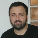 Person with beard smiling, representing customer satisfaction with American Foundation Specialists' foundation and basement repair services.