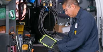 Technician working on ipad servicing equipment