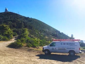 Air Systems van with mountains in background