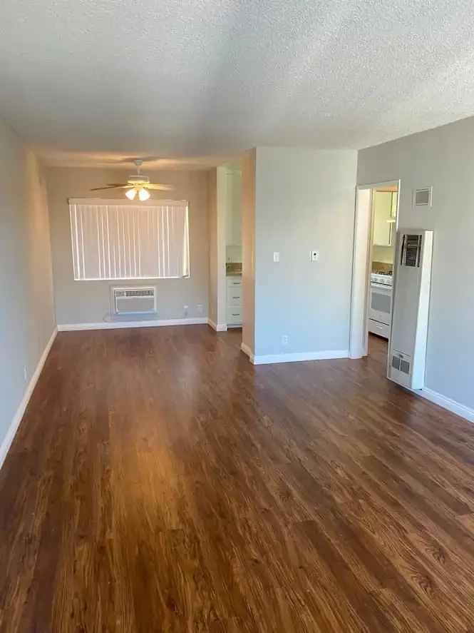 Luxury vinyl plank flooring installed in a Pasadena living room, featuring modern wood-look planks, clean lines, and durable flooring design.