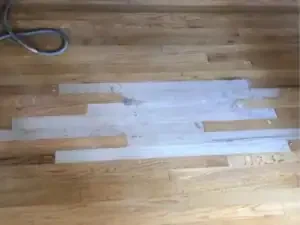 Hardwood floor repair with damaged plank replacement in a Palos Verdes residential home