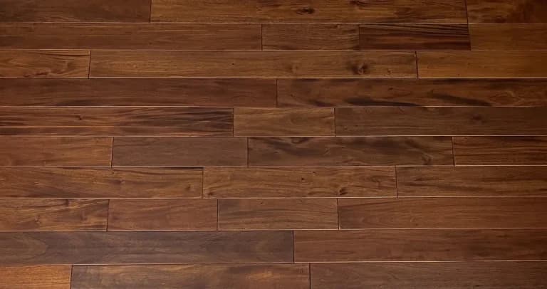 Solid mahogany hardwood floor installation showcasing rich wood grain, smooth finish, and professional craftsmanship in a residential interior.