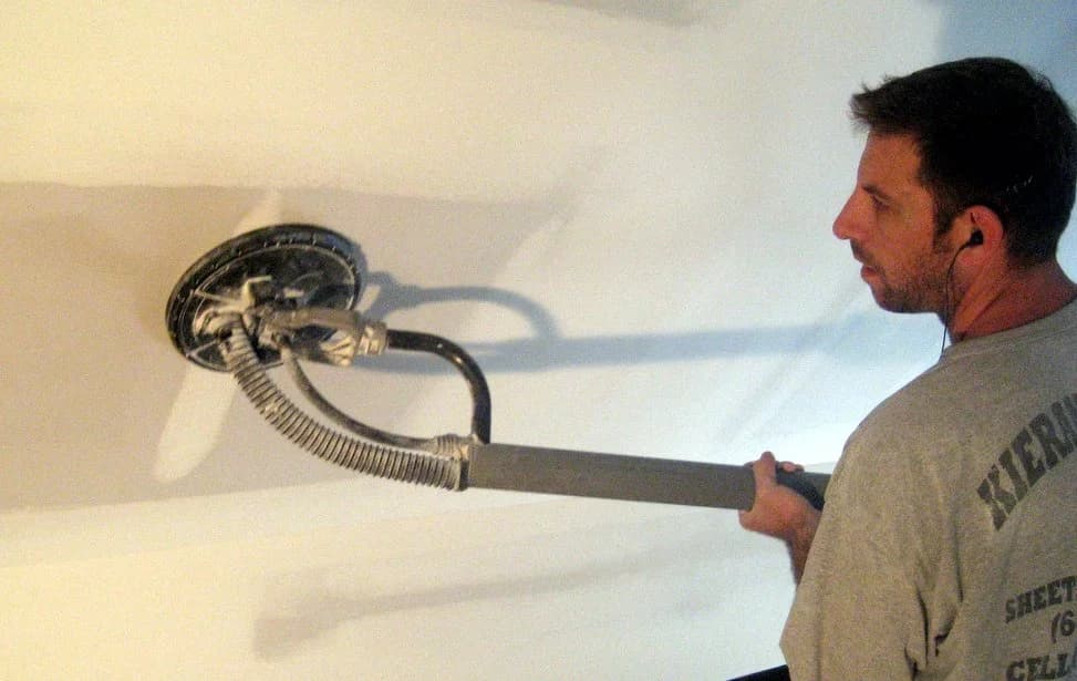 drywall contractor with sander