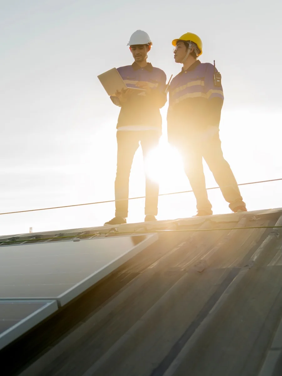 men inspecting roof
