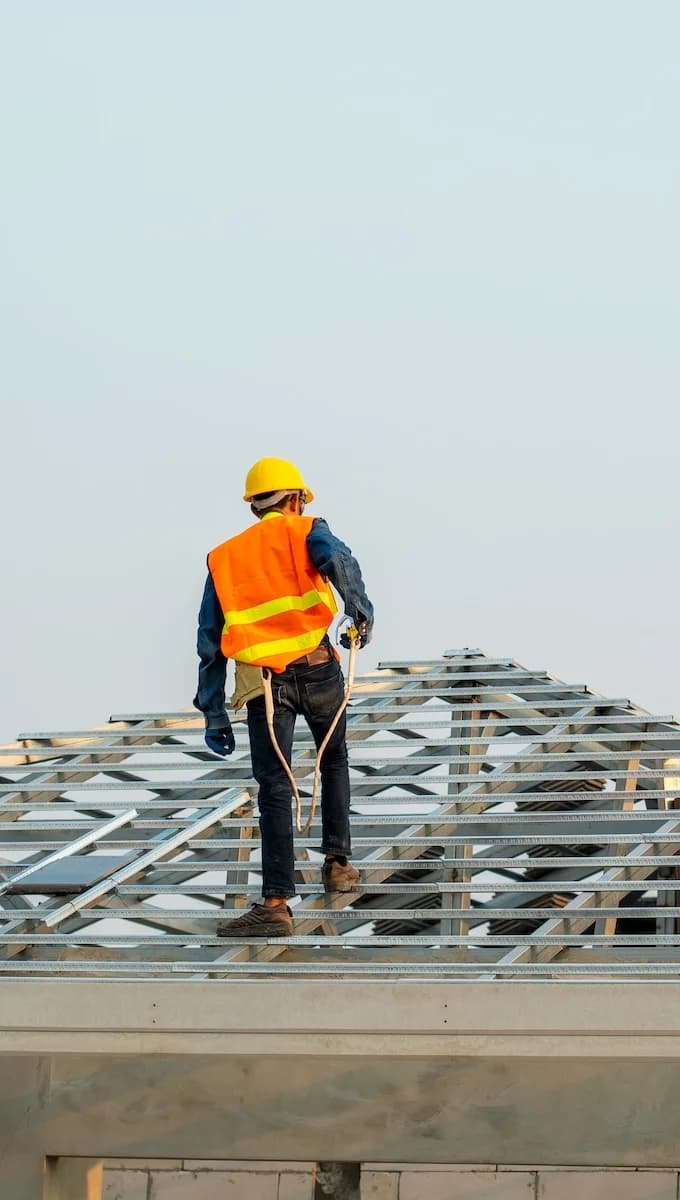 man working on roof