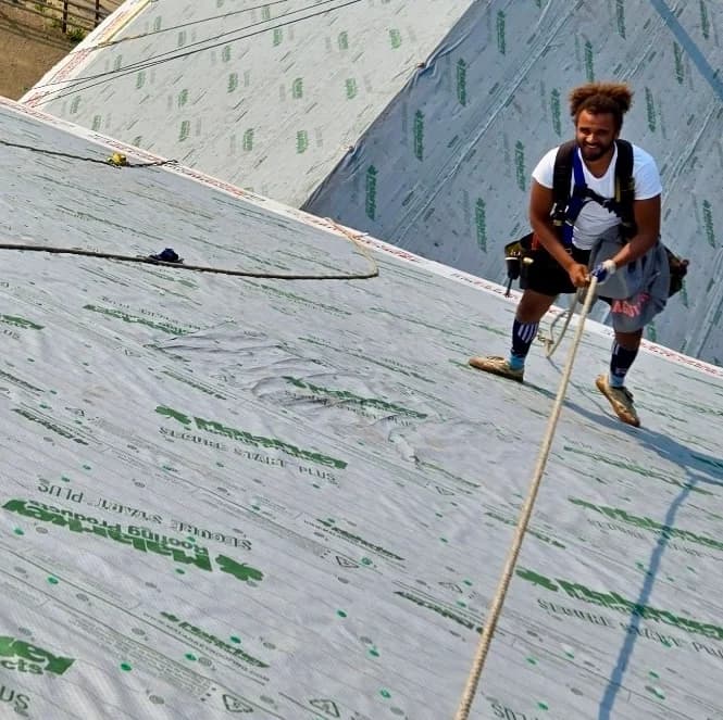 man installing roof