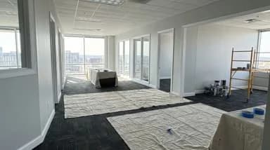 Freshly painted modern commercial office interior with light gray walls and white trim in Nashville, TN