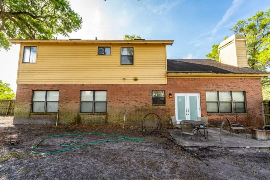 Surface CPR soft washing brick mold from home exterior