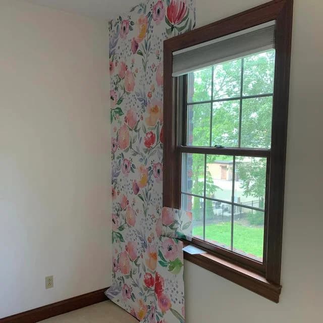 We added some decorative wallpaper to this residential home's bedroom.