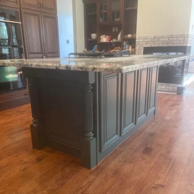 We painted this kitchen island in a new construction home. The slate black paint really stands out nicely.