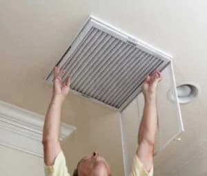 man cleaning the filter