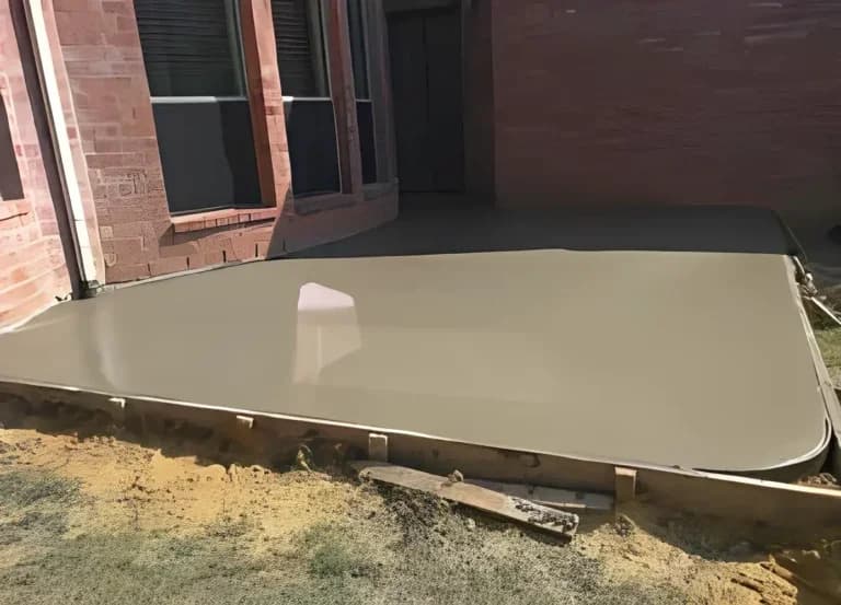 smooth finish backyard concrete patio still wet in Daytona Beach