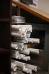 Stacked electrical project plans at Cascade Electric in Tucson, Arizona