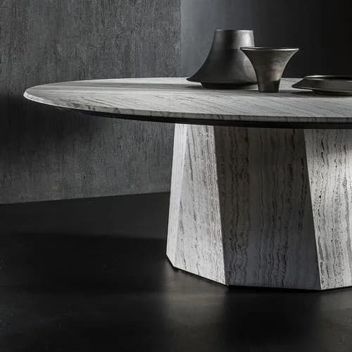 round dining table made in-house in steel covered in gray stone and wooden tops