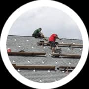 Men doing roof repair